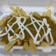 Loaded Chips with curry sauce.